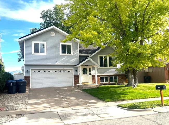 Light gray siding exterior with a two-car garage