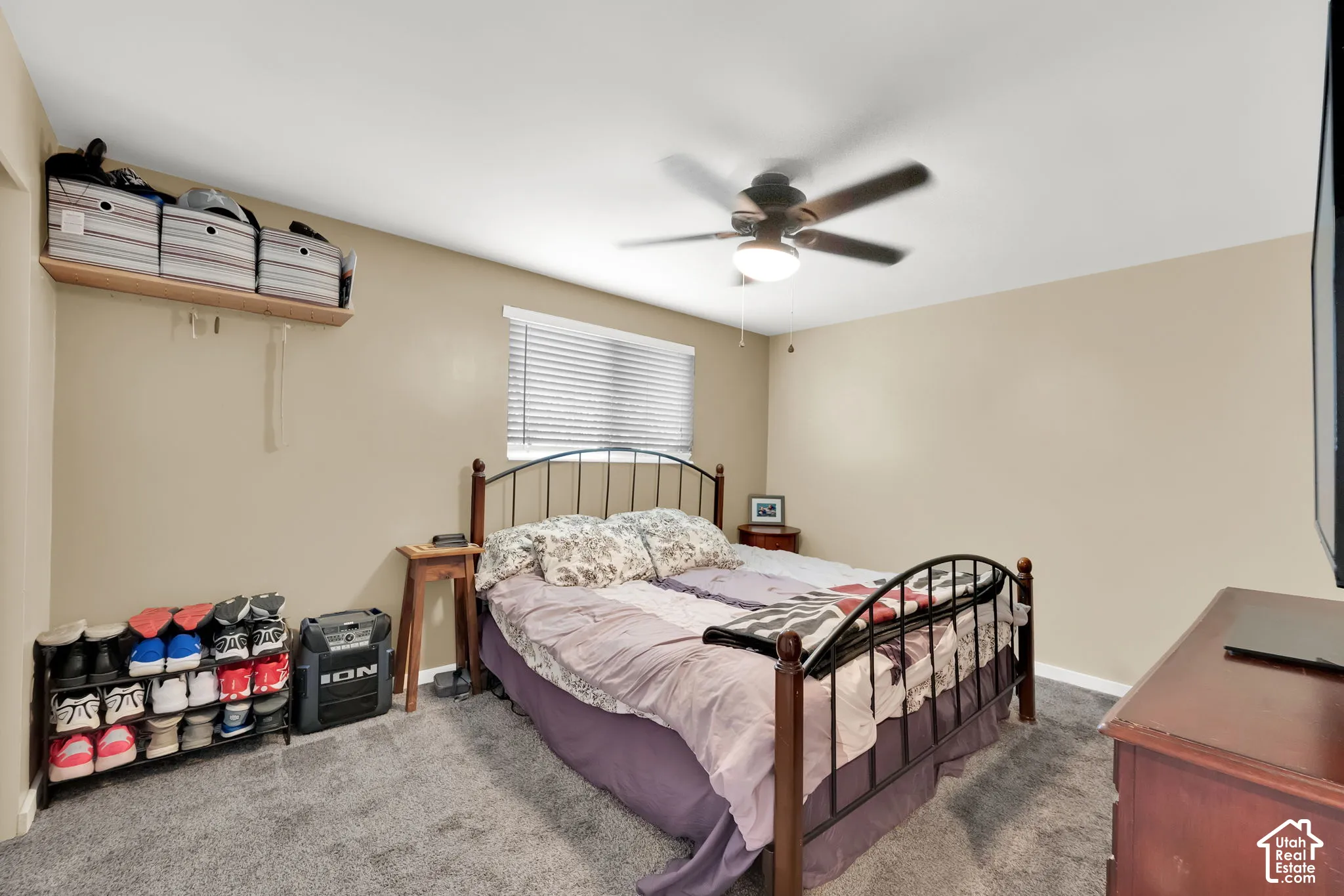 Neutral-toned walls complement the textured carpet flooring