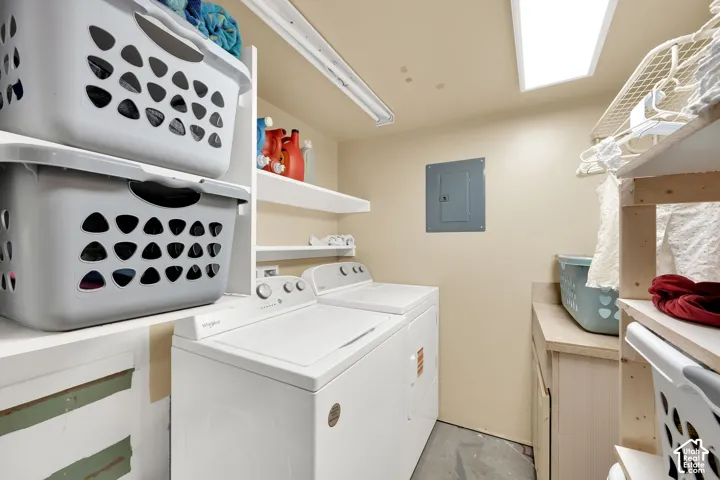 Built-in shelving, overhead fluorescent lighting, and a utility sink with a countertop