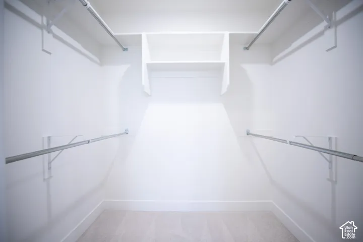 Primary bedroom walk-in closet