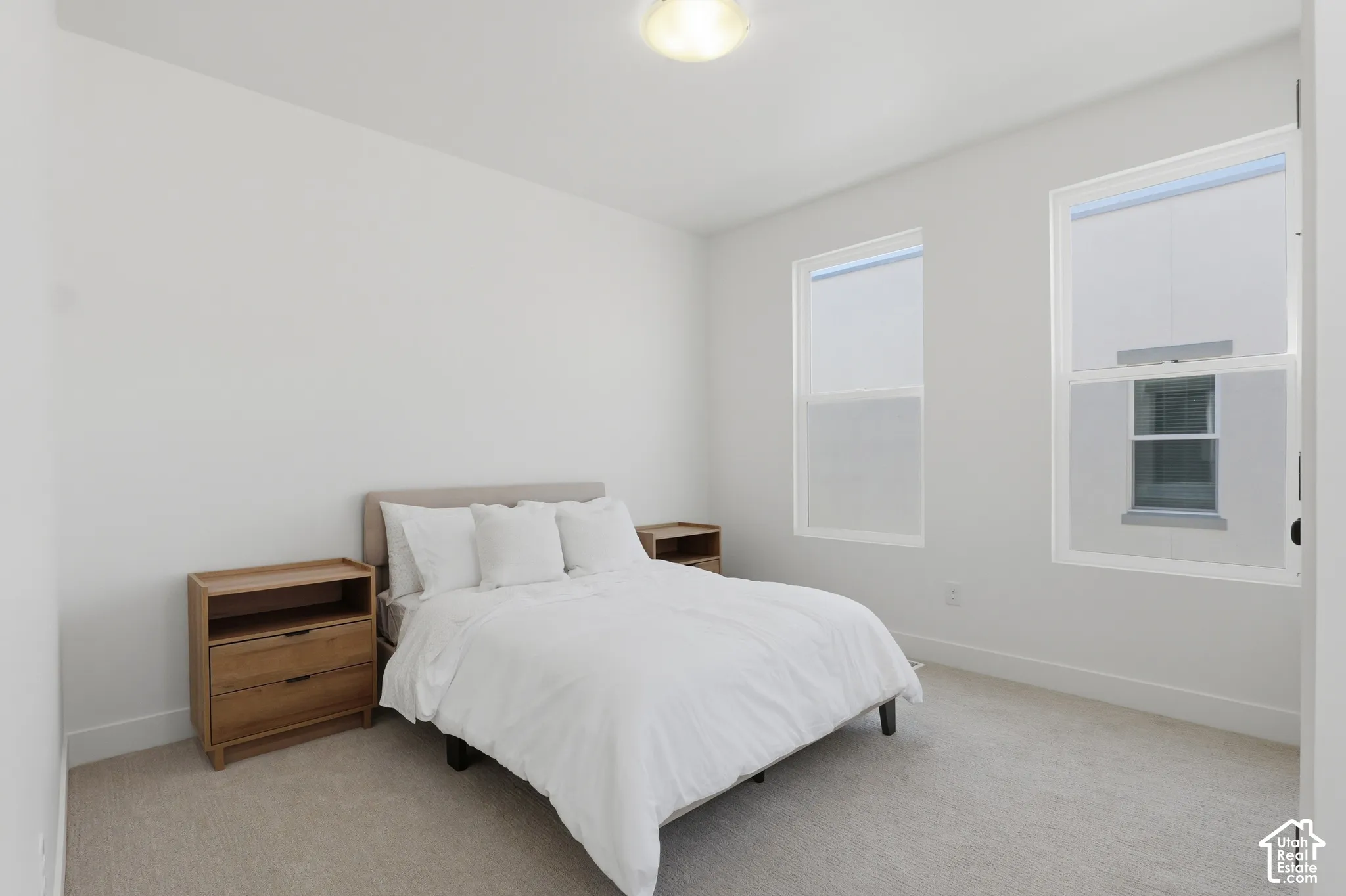 Light-colored wall-to-wall carpeting throughout