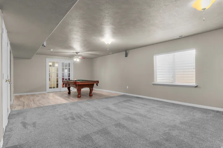 Recessed lighting and ceiling-mounted light fixtures illuminate the space