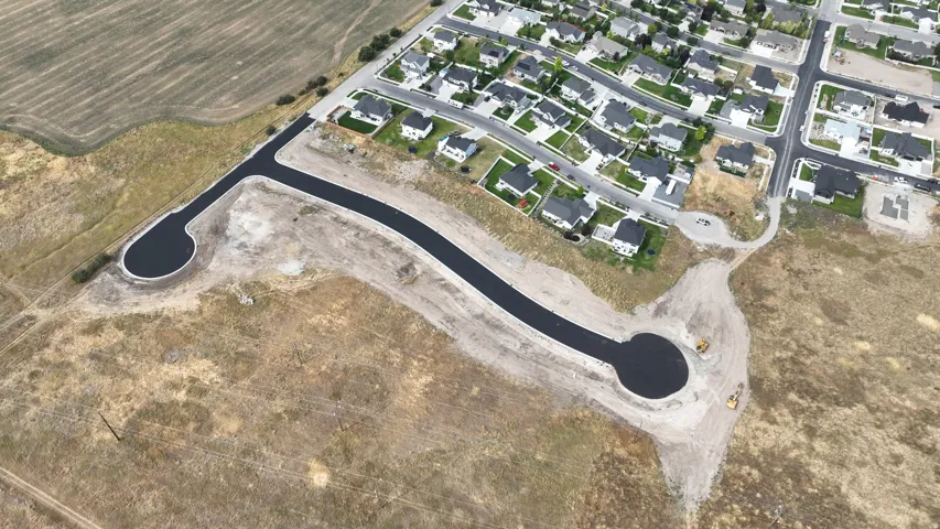 New construction development featuring a paved cul-de-sac and established residential area
