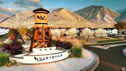 Entry monument featuring a water tower, multi-tiered water feature, and decorative landscaping