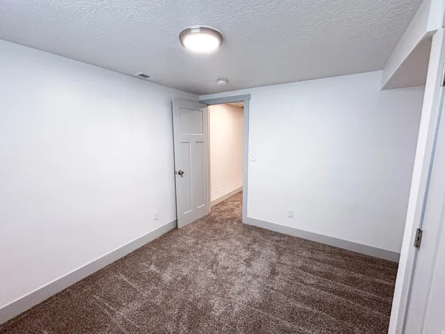 Neutral-toned carpeting throughout