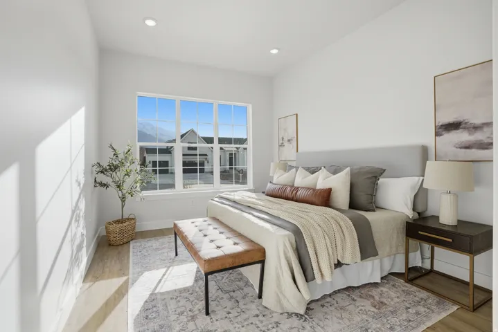 Recessed lighting, wood-finish flooring, and a multi-pane window