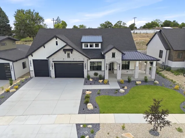 Modern farmhouse exterior with board and batten siding and stone accents