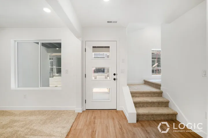 White interior walls with recessed lighting