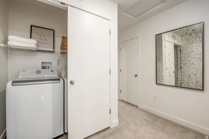 Laundry closet with wire shelving and a sliding door