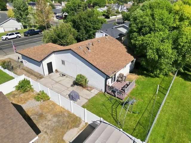Brown shingle roofing with white siding