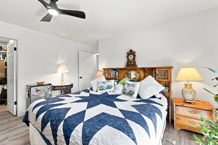 Light wood-finish flooring with white walls