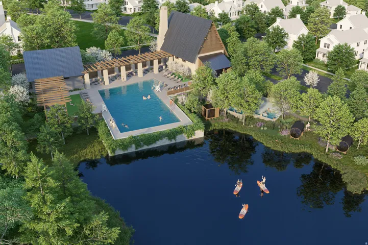 Expansive lakefront setting with a swimming pool, shaded lounge areas, and a multi-story clubhouse