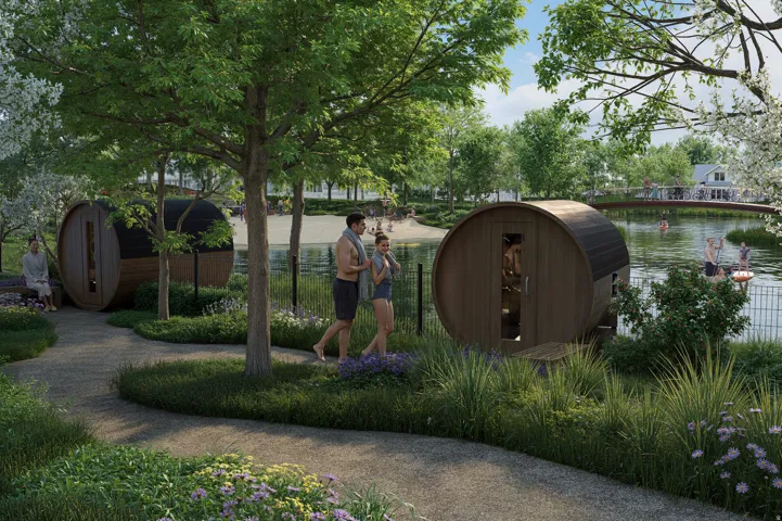Landscaped grounds with a paved pathway, barrel saunas, and mature trees