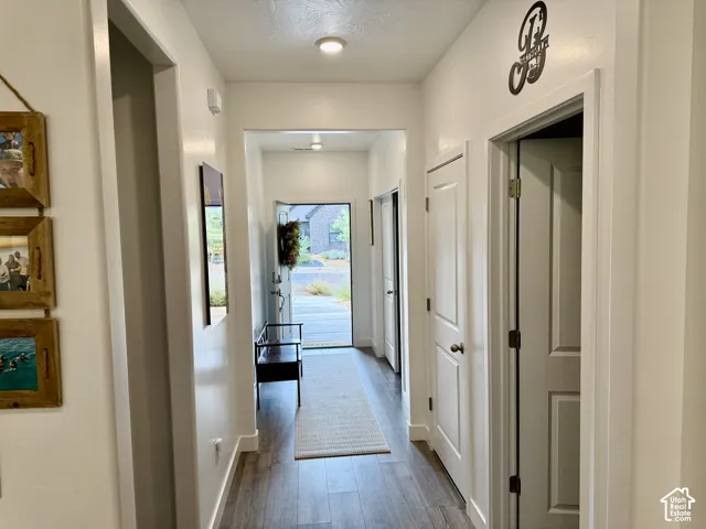Entryway featuring wood-finish flooring, recessed lighting, and white paneled interior doors