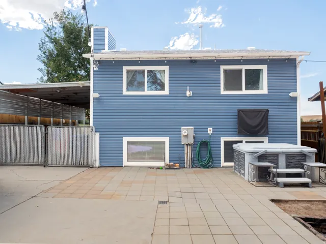 Expansive paved patio with a built-in spa