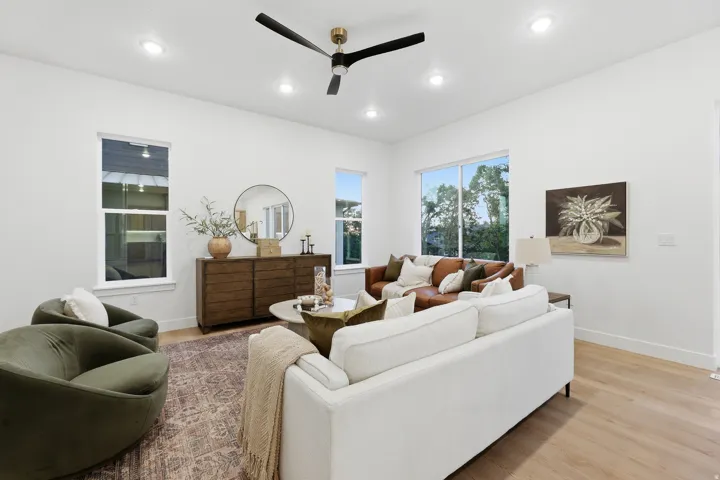 Recessed lighting, wood-finish flooring, and multiple windows