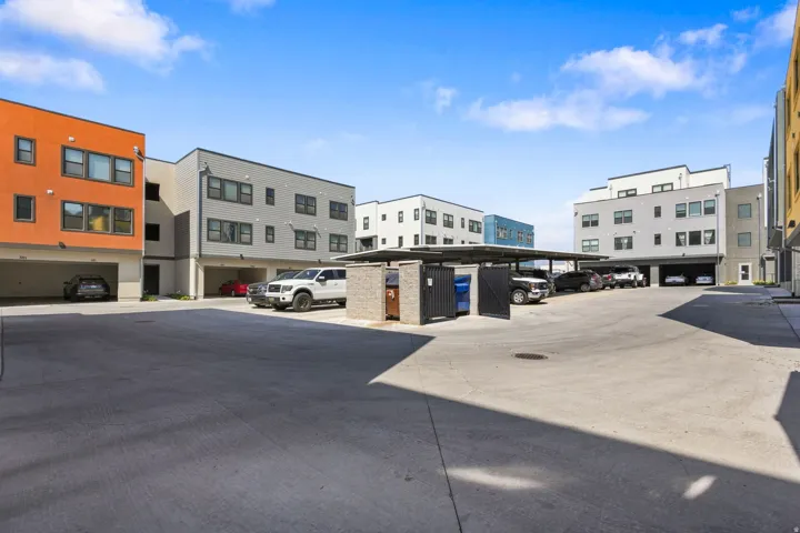 Modern multi-story buildings featuring varied exterior finishes