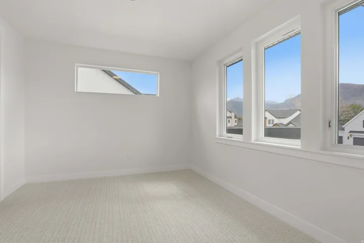 Bright interior with multiple windows, including a horizontal transom window