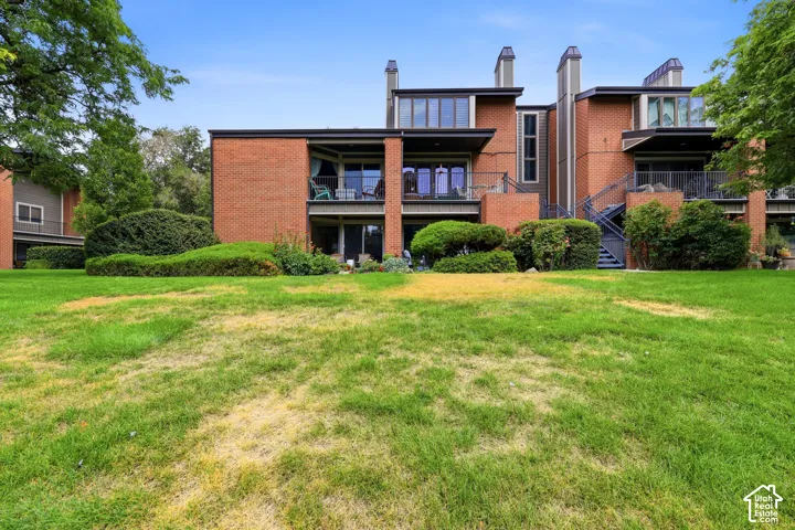 Brick exterior architecture with multiple balconies and exterior stairs