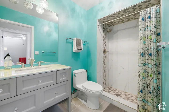 Vanity with a light-toned countertop and an integrated sink