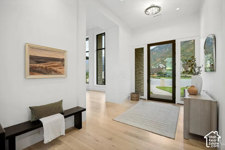 Light wood-finish flooring with crisp white walls