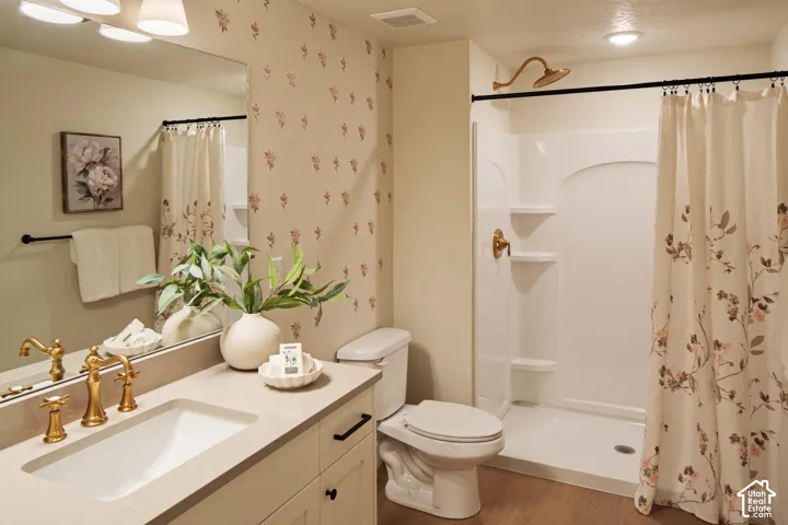 Integrated vanity with an undermount sink and gold-finish fixtures