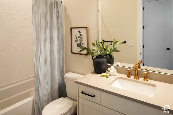 Built-in vanity with undermount sink, brass-finish faucet, and integrated countertop