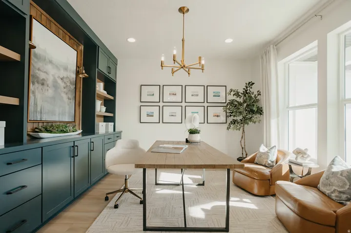 Built-in cabinetry with integrated shelving, wood-finish flooring, recessed lighting, and large windows