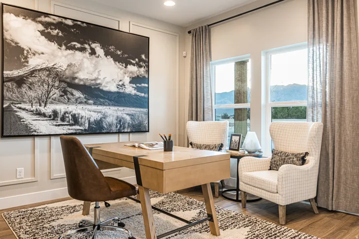 Wood-finish flooring, recessed lighting, and large windows with privacy drapery