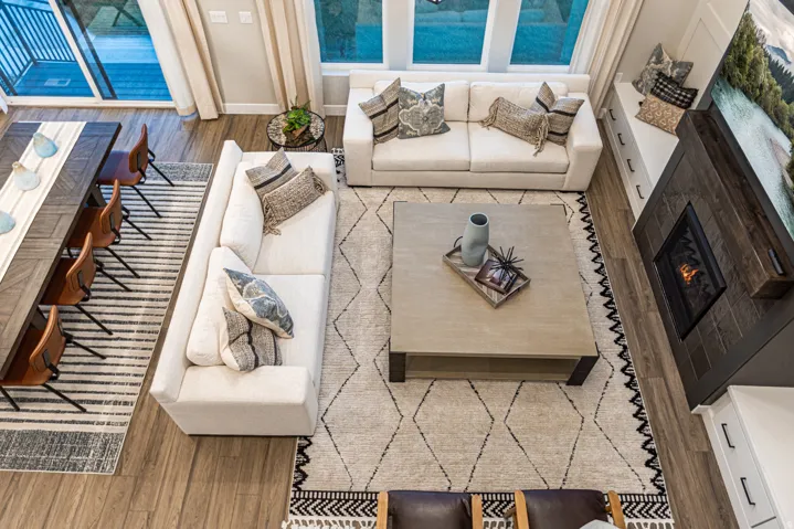 Wood-finish flooring throughout, a gas fireplace with a wood mantel, a built-in window bench with storage, and a sliding glass door