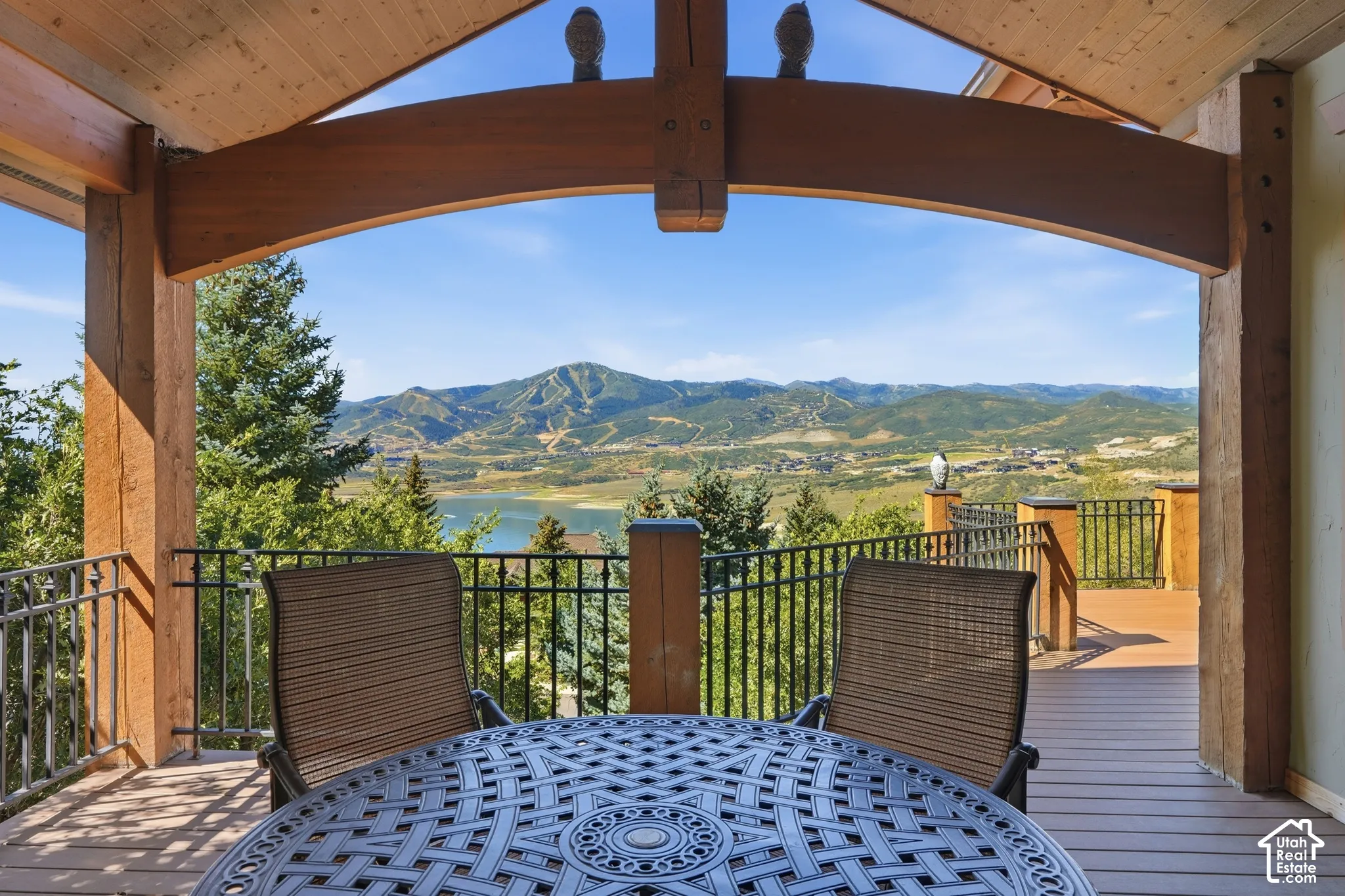 Expansive outdoor deck with mountain and water scenery