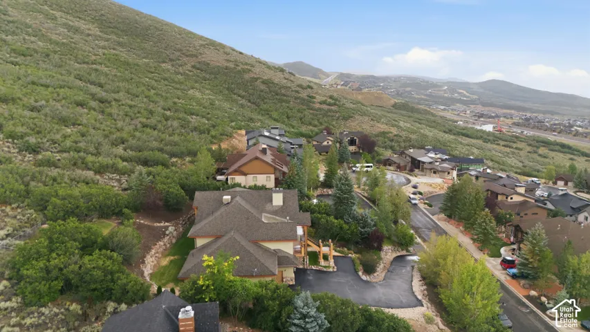 Terraced neighborhood setting with paved roadways and mature landscaping
