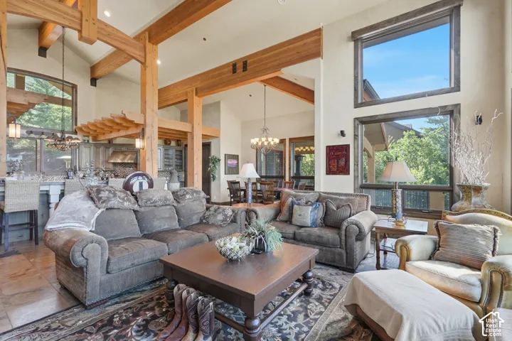 Exposed wood beams, vaulted ceilings, and large windows with wood trim