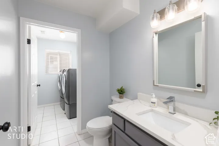 Vanity with white countertop, integrated sink, and chrome faucet