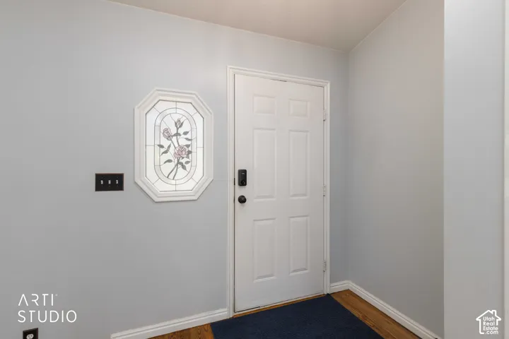 Panel door with a digital lock, framed by white trim