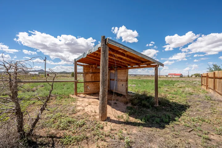 Shelter structure with wood posts and a metal roof