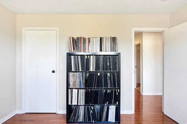 Wood-finish flooring with light-toned wall paint and white trim