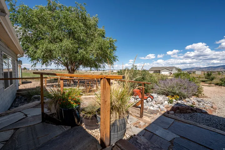 Flagstone patio with natural wood railing