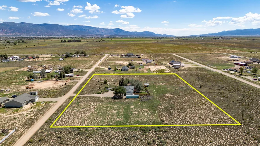 Expansive lot with a single-story residence and detached structures