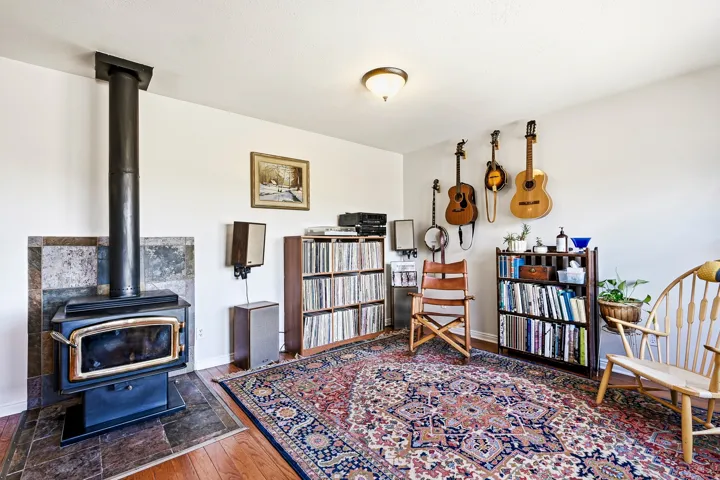 Wood-burning stove with a tile surround and hearth