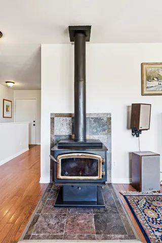 Wood-burning stove with a tile surround and hearth