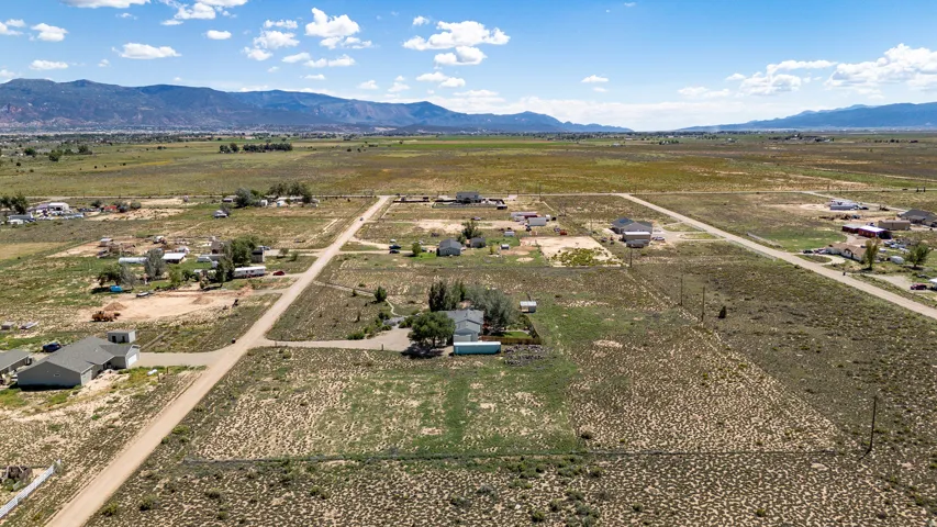 Expansive open land with distant mountain ranges