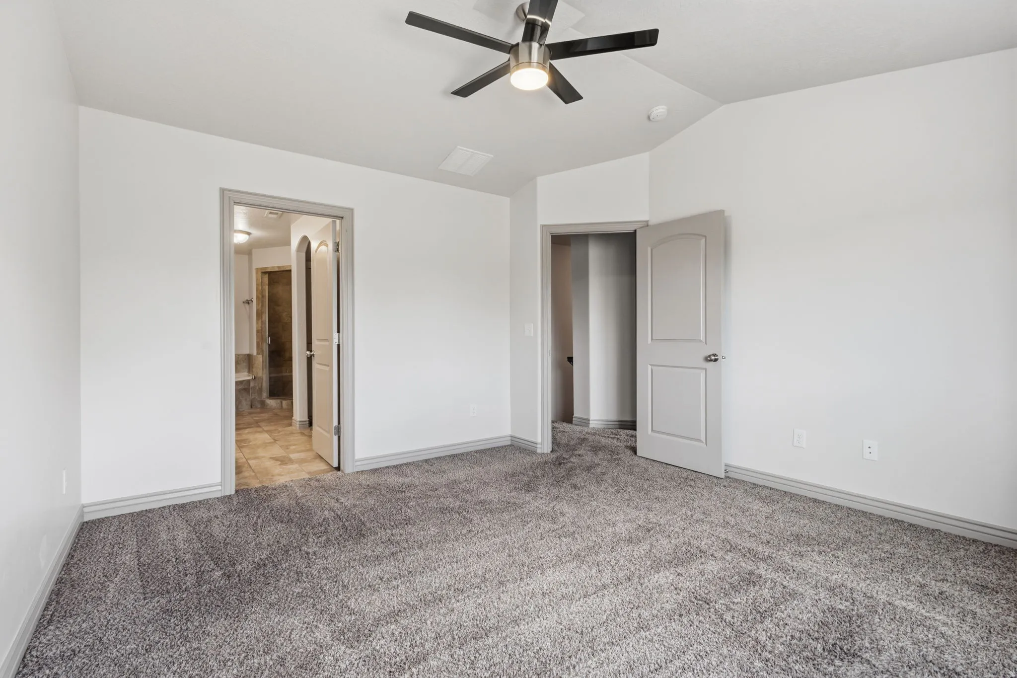 Ceiling fan with brushed nickel accents, gray carpet flooring, white walls, and gray trim