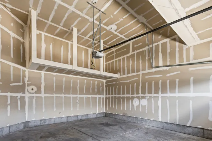 Concrete floor, overhead storage units, and automatic garage door opener