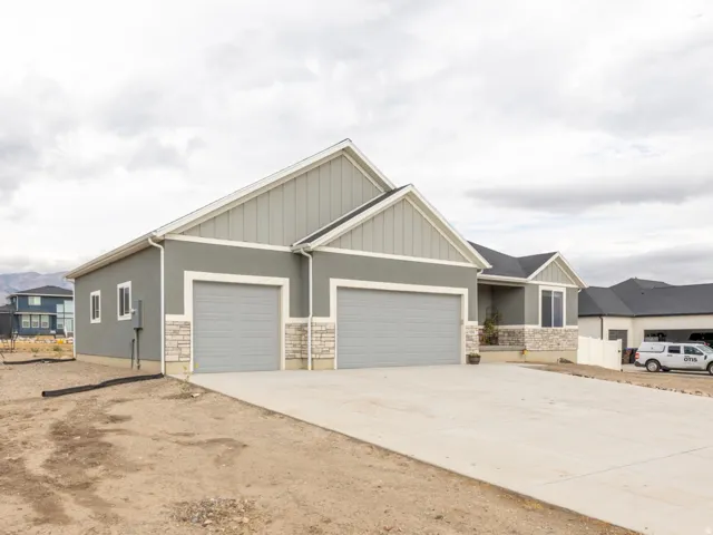 Extra wide 3 car garage that also has a large workshop area