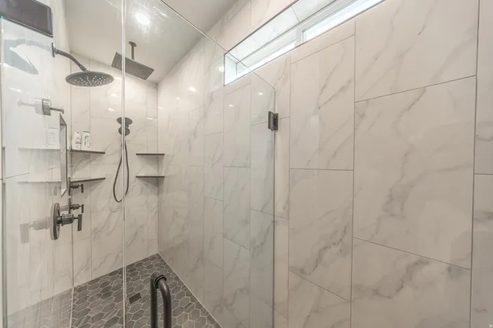 in the primary there is a large walk in dual head shower
