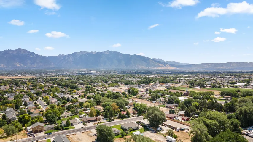 Expansive mountain range backdrop and mature treeline