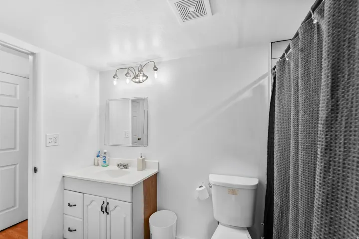 White vanity with under-sink storage