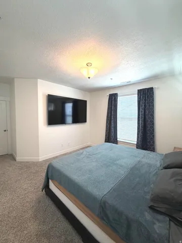 Wall-mounted television with visible wiring