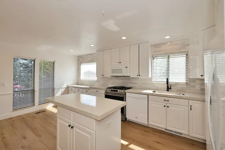 Kitchen center island with room for dining room table.